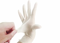 Les gants jetables d'examen médical de latex 24cm saupoudrent librement