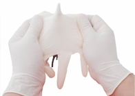 Les gants jetables d'examen médical de latex 24cm saupoudrent librement